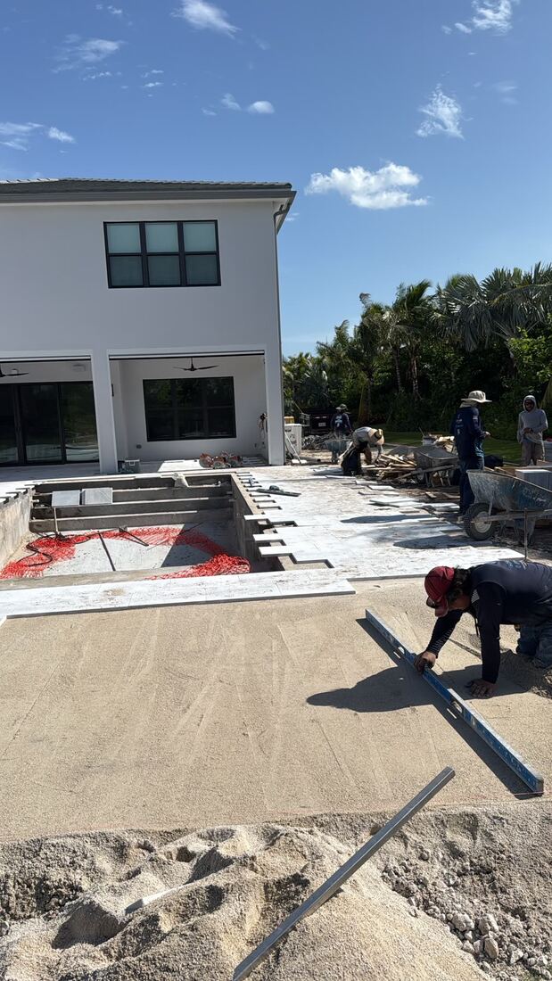 Crew leveling the paver base
